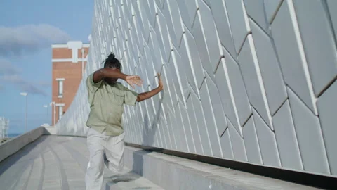 Dramatic man express emotions urban street. Flexible performer rehearsing dance Stock Footage 227223781