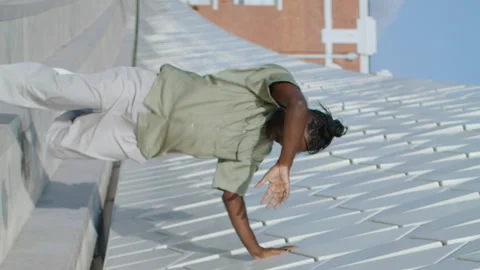 Dramatic man express emotions urban street vertically. Flexible performer dance Stock Footage 247930514