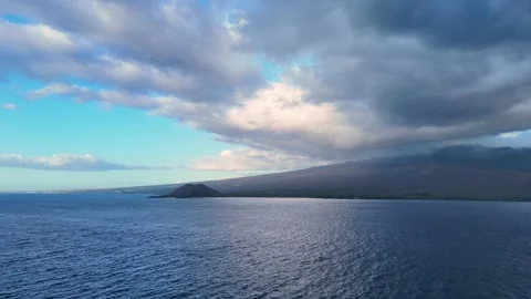 Dramatic Maui Coastline and Volcanic Landscape Under Cloudy Sky – Aerial 4K Stock Footage 320805683