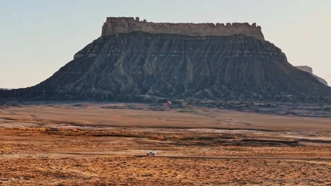 Dramatic Mesa Rising from Flat Desert Terrain Hanksville Utah Stock Footage 333872881