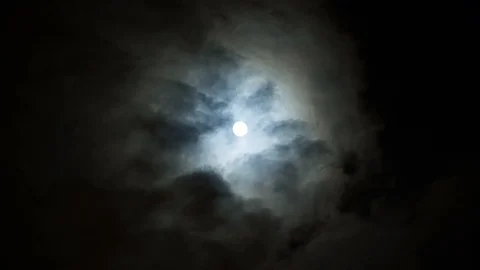 Dramatic midnight moon on night cloudy sky. Clouds run slowly across the sky. Stock Footage 108013710