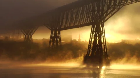 Dramatic misty fog dance around bridge Stock Footage 996839