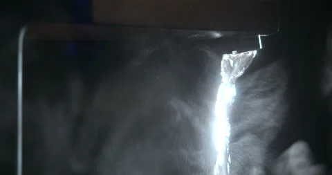 Dramatic Modern Matte Black Waterfall Faucet With Backlit Flowing Water Stock Footage 344011470