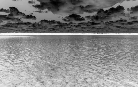 Dramatic monochrome seascape with textured clouds 스톡 사진
