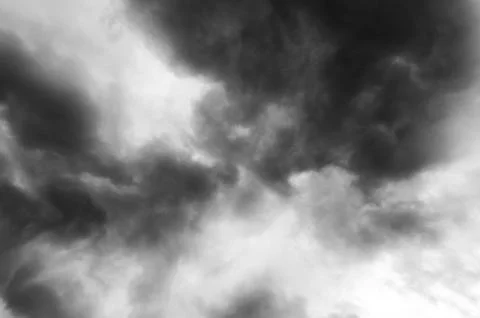 Dramatic monochrome sky filled with dark, ominous storm clouds Stock Photos