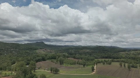 Dramatic Monsoon Cloudscape Over Mountain Range and Vast Green Farmland, No.. Stock-Footage 337018260