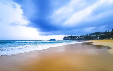 Dramatic monsoon rain clouds turquoise surf Kata Noi Beach Thailand Stock Photos