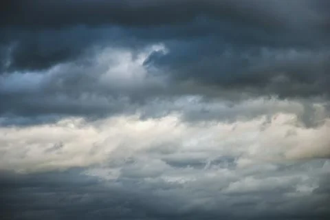 Dramatic moody sky, ominous cloudscape, thunderclouds in windy autumn sky 写真素材