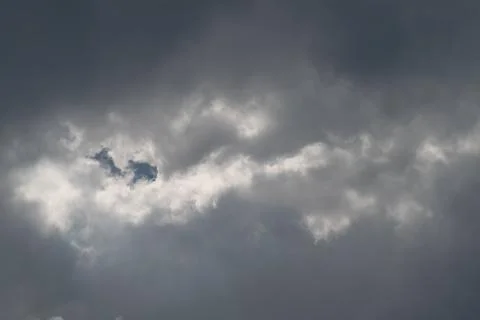Dramatic moody sky with sunlit cloud break 写真素材
