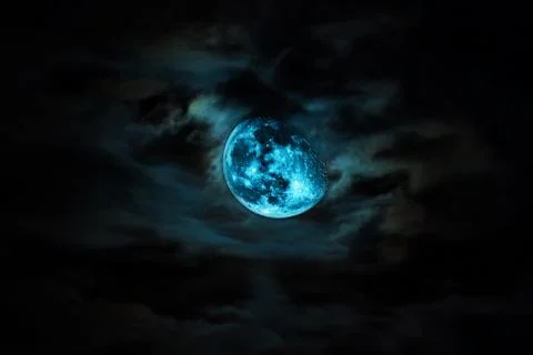 Dramatic moon and clouds . Stock Photos