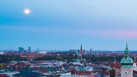 Dramatic Moonrise above Munich's Iconic Landmarks at Twilight Stock Footage 261813736