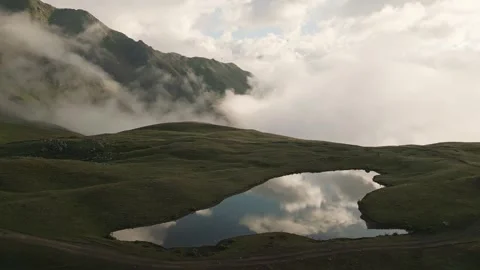 Dramatic morning mist rolling over the Koruldi Lakes in Svaneti, Georgia. A.. Stock-Footage 332117436