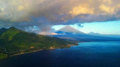 Dramatic Mount Agung Over Amed Coastline, Bali At Sunset From Drone Stock Photos