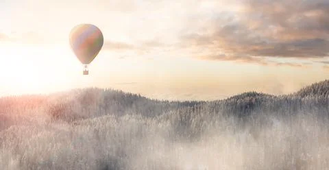 Dramatic Mountain Landscape covered in clouds and Hot Air Balloon Flying Stock Illustration