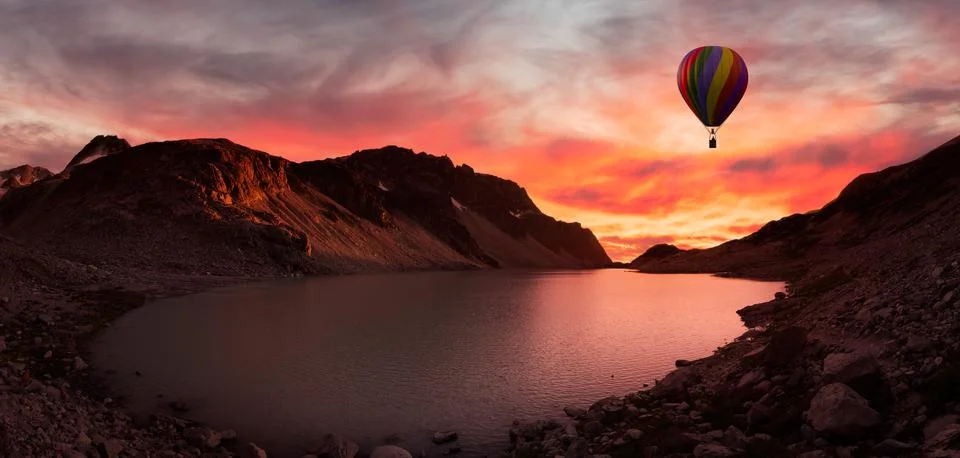 Dramatic Mountain Landscape covered in clouds and Hot Air Balloon Flying. Stock Illustration