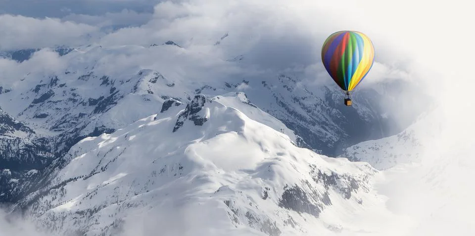 Dramatic Mountain Landscape covered in clouds and Hot Air Balloon Flying Stock Illustration