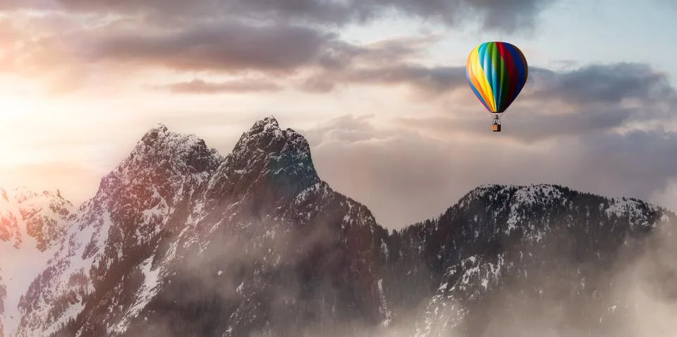 Dramatic Mountain Landscape covered in clouds and Hot Air Balloon Flying. Stock Illustration