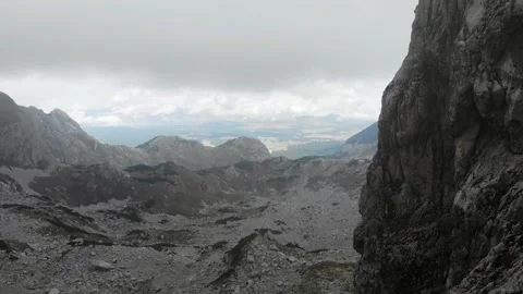 Dramatic mountain landscape showcasing rocky terrain and distant peaks Stock Footage 324748609