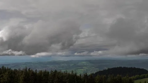 Dramatic mountain landscape timelapse with fast moving storm clouds over gr.. Video stock 337447725