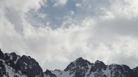 Dramatic mountain peak covered in snow in winter Stock Footage 124716992