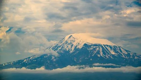 Dramatic mountain peak covered in snow Stock Photos