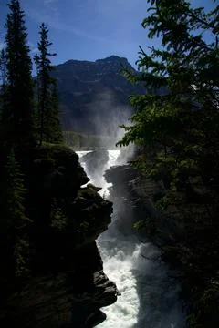 Dramatic Mountain Peak Towering Over Misty Athabasca Falls Stock Photos
