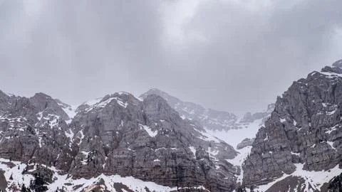 Dramatic mountain peaks create stunning backdrop for adventure tourism Stock Photos
