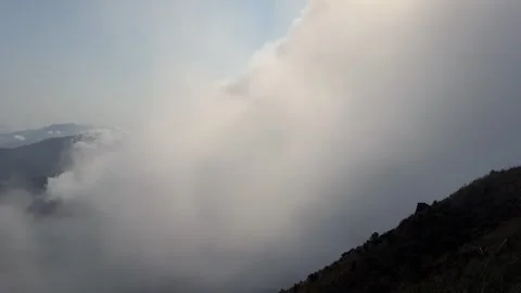 Dramatic Mountain Peaks Emerging from Dense Fog and Cloudscape China Stock Footage 338311702
