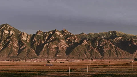 Dramatic Mountain Range and Rural Valley Forward Ascend 4K HLG Stock Footage 344016064