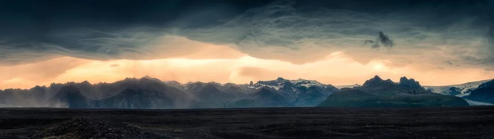 Dramatic of mountain range with asperlitas cloud and sand storm on lava field Stock Photos