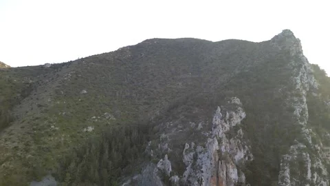 Dramatic Mountain Silhouette and Rocky Peaks (Midday Light) Stock Footage 318523346