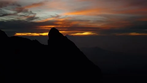 Dramatic Mountain Silhouette at Fiery Sunset Stock Footage 318251430