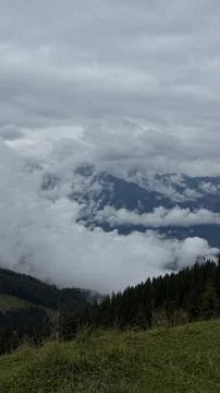 Dramatic Mountain View with Clouds from the Summit Stock Photos