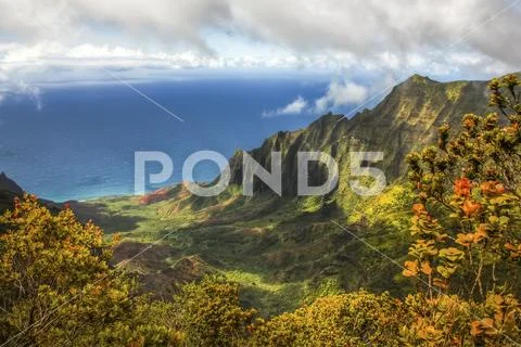 Dramatic mountainous terrain and colourful foliage on a Hawaiian island with a v Stock Photos