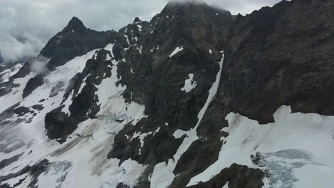 Dramatic Mountains in the Mist and Clouds, Glaciers and Snow, Drone Shot Stock Footage 169553774