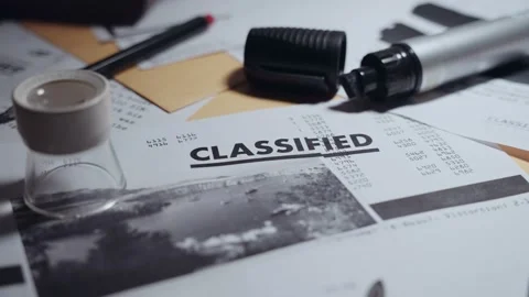 Dramatic moving light showing classified stamped memo or paper on office desk Stock Footage 199974642