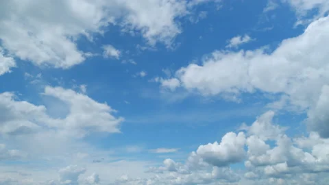 Dramatic moving white cumulus and cirrocumulus clouds or puffy fluffy cloudscape Stock Footage 210257384