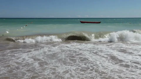 Dramatic muddy ferocious ocean breaking waves washing beach sand Video stock 37694837