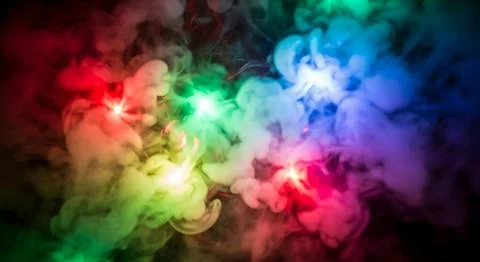 Dramatic multi-colored smoke on black background with vivid red green blue .. 스톡 일러스트