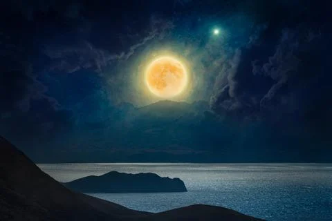 Dramatic mystical background - rising full moon in dark night sky above mount Stock Photos