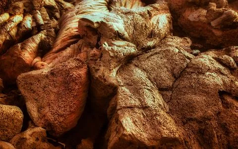 Dramatic natural rock formations with textured surfaces and organic shapes .. Stock Photos