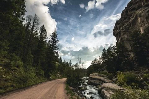 Dramatic nature scene under blue sky and vibrant clouds Stock Photos