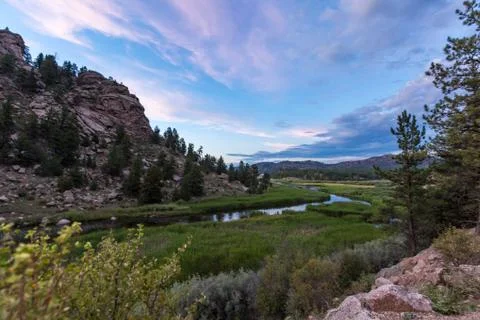 Dramatic nature scene under blue sky and vibrant clouds Stock Photos