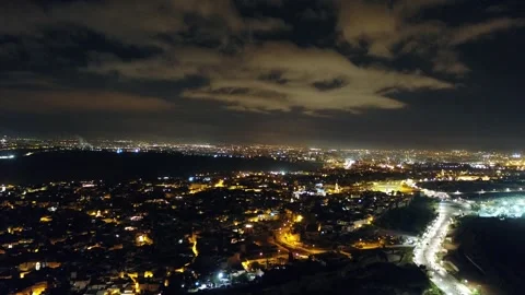 Dramatic Night Aerial of Fez City Lights Under Cloudy Sky, Morocco Stock Footage 343939579