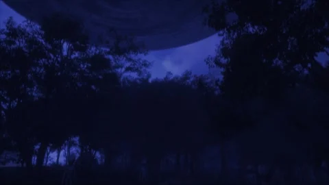 Dramatic night scene of a UFO flyover with a camera tilt down into dark Vídeos de archivo 311160343