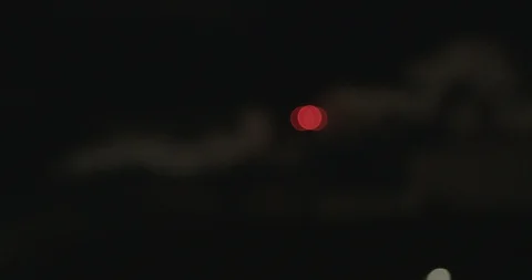 Dramatic night shot of white smoke eminating from a factory chimney with red Video stock 129747849