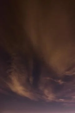 Dramatic Night Sky Cloud Formations with Subtle Aurora Glow Nevada Astropho.. Stock Photos