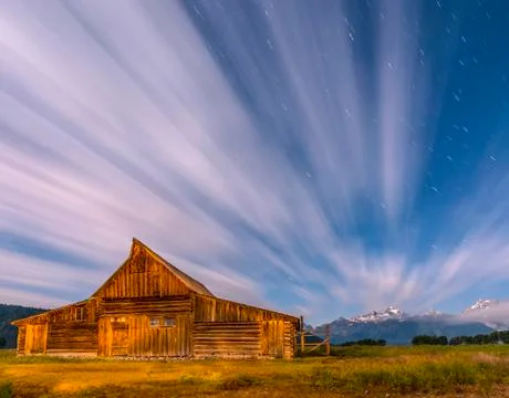 Dramatic night sky at mormon row with view at grand teton Stock Photos