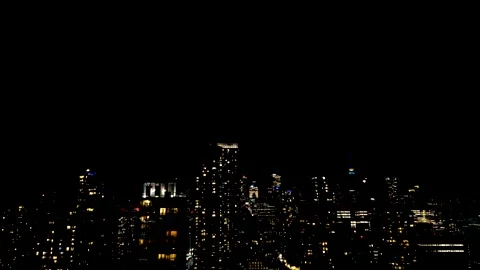 A dramatic night skyline of Toronto flashes under a powerful lightning storm.  Video stock 347680342