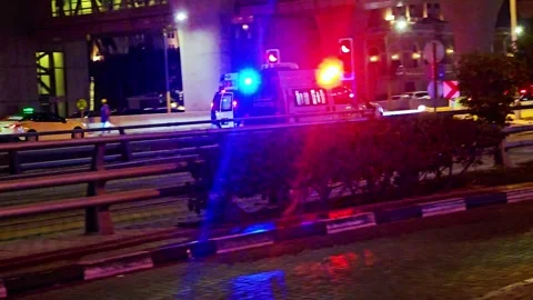 Dramatic night view of glowing red and blue emergency vehicle light reflections Video stock 345768033
